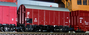 сбоку, между Exact-train и Roco